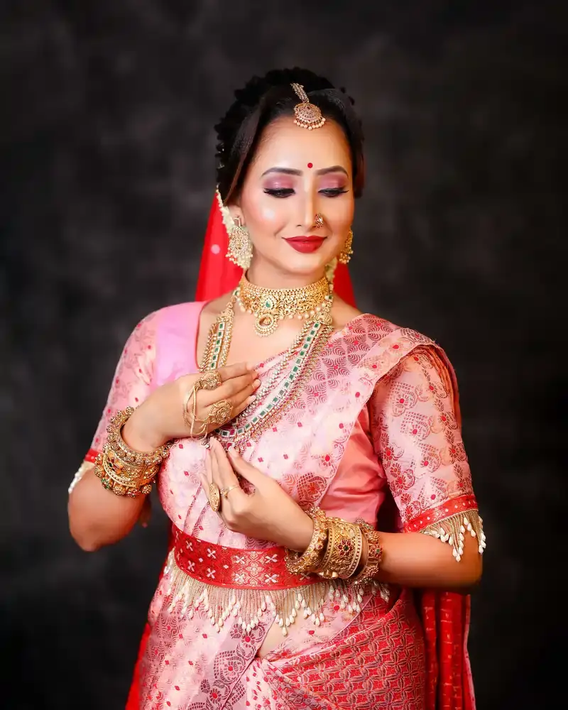 Assamese bride look by Chandrama Kalita showcasing traditional bridal makeup and attire